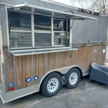 Wood-Paneled Kubota GL11000 Food Trailer
